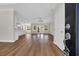 Open concept living space with hardwood floors, crown molding, fan, and bright light at 2588 Lake Vista Dr., Little River, SC 29566