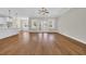 Open floorplan with hardwood floors and views to the kitchen and backyard at 2588 Lake Vista Dr., Little River, SC 29566