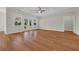 Well-lit living space featuring wood floors, neutral walls, and French doors leading to outdoor views at 2588 Lake Vista Dr., Little River, SC 29566