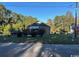 Charming single-story home with a well-maintained lawn and mature trees at 4029 Lincoln Heights Rd., Little River, SC 29566