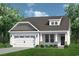 A charming single-Gathering home features a well-manicured lawn and a classic white exterior with stone and column accents at 5040 Cambria Ct., Little River, SC 29566
