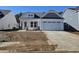 Charming single-Gathering home with a white exterior, a two-car garage, and newly installed cement driveway at 5040 Cambria Ct., Little River, SC 29566
