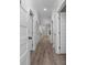 Hallway with wood floors leading to the kitchen and living room at 627 Bonaventure Dr. # 202, Myrtle Beach, SC 29577