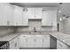 Well-equipped kitchen showcasing granite countertops and bright white cabinetry for a clean aesthetic at 627 Bonaventure Dr. # 202, Myrtle Beach, SC 29577