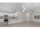 Modern kitchen with stainless steel appliances and breakfast bar overlooking living spaces at 627 Bonaventure Dr. # 202, Myrtle Beach, SC 29577