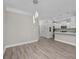Open layout kitchen to the living area featuring modern light fixture at 627 Bonaventure Dr. # 202, Myrtle Beach, SC 29577