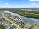 Gorgeous aerial view of a lakeside community surrounded by lush woodlands at 1066 Brentford Pl., Myrtle Beach, SC 29579