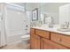 Bathroom with a combined tub and shower, a vanity, and a toilet at 1066 Brentford Pl., Myrtle Beach, SC 29579