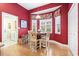 Breakfast nook with a bright bay window and warm red walls at 1066 Brentford Pl., Myrtle Beach, SC 29579
