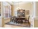 Formal dining room with ample natural light, stylish furniture, and a decorative chandelier at 1066 Brentford Pl., Myrtle Beach, SC 29579