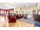 Open concept living room showcasing hardwood floors, plush seating, and seamless flow to the kitchen at 1066 Brentford Pl., Myrtle Beach, SC 29579