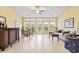 Bright and airy sunroom featuring tile floors, large windows, and comfortable seating for relaxation at 1066 Brentford Pl., Myrtle Beach, SC 29579