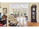Bright sun room with tiled floors, comfortable seating, and plenty of natural light from large windows at 1066 Brentford Pl., Myrtle Beach, SC 29579
