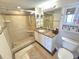 Tiled bathroom featuring a shower with glass door, granite counters and a full mirror at 2007 S Ocean Blvd. # 401, Myrtle Beach, SC 29577