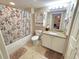 Bathroom featuring a shower-tub combo, a toilet, and a vanity with granite counters at 2007 S Ocean Blvd. # 401, Myrtle Beach, SC 29577
