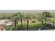 Beautiful beach view from the balcony of a high-rise resort with palm trees and beach access at 2007 S Ocean Blvd. # 401, Myrtle Beach, SC 29577