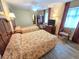 Comfortable bedroom with two beds, a TV, and wood-look flooring for a relaxing stay at 2007 S Ocean Blvd. # 401, Myrtle Beach, SC 29577