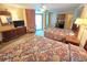 Comfortable bedroom featuring two beds, wood-look floors, a ceiling fan, and a flat-screen television at 2007 S Ocean Blvd. # 401, Myrtle Beach, SC 29577