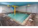 Indoor pool with brick decking and a water feature at 2007 S Ocean Blvd. # 401, Myrtle Beach, SC 29577