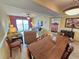 Bright living space with comfortable furniture, balcony access and an adjacent dining area at 2007 S Ocean Blvd. # 401, Myrtle Beach, SC 29577
