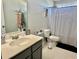 Bathroom with a large sink, decor, and a black and white shower curtain at 276 Palmetto Glen Dr., Myrtle Beach, SC 29588