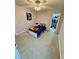 Bright bedroom featuring a single bed, ceiling fan, lots of natural light, and walk-in closet at 276 Palmetto Glen Dr., Myrtle Beach, SC 29588