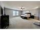 Spacious main bedroom featuring a large bed, ceiling fan, and lots of natural light at 276 Palmetto Glen Dr., Myrtle Beach, SC 29588