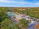 Stunning aerial view of community clubhouse with tennis courts and neatly arranged parking at 3034 Oak Grove Bend # 34 Ar, Murrells Inlet, SC 29576