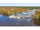 Aerial view of a full marina, complete with yachts, and surrounded by autumn foliage at 3034 Oak Grove Bend # 34 Ar, Murrells Inlet, SC 29576