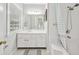Bright bathroom featuring a window, shower and tub combination, and ample vanity storage at 3034 Oak Grove Bend # 34 Ar, Murrells Inlet, SC 29576