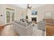 Bright living room with fireplace, wood floors, and access to outdoor balcony at 3034 Oak Grove Bend # 34 Ar, Murrells Inlet, SC 29576
