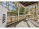 A large screened porch with a view of the private backyard and mature trees at 3034 Oak Grove Bend # 34 Ar, Murrells Inlet, SC 29576