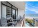 Spacious balcony features ocean and pool views with multiple chairs for relaxation at 5308 N Ocean Blvd. # 1014, Myrtle Beach, SC 29577