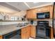 The kitchen features granite countertops, updated appliances, and lots of wood cabinets at 5308 N Ocean Blvd. # 1014, Myrtle Beach, SC 29577