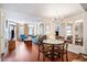 The living and dining room area features comfortable seating and a dining area with seating for four at 5308 N Ocean Blvd. # 1014, Myrtle Beach, SC 29577