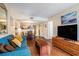 The living room opens to the dining area and features a large TV and comfortable furnishings at 5308 N Ocean Blvd. # 1014, Myrtle Beach, SC 29577