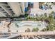 Overhead view of the pool showcasing a unique winding design with palm trees and tropical landscaping at 5308 N Ocean Blvd. # 1014, Myrtle Beach, SC 29577