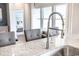 Modern kitchen detail showing a pull-down faucet and granite countertop at 9727 Indigo Creek Blvd., Murrells Inlet, SC 29576