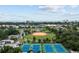 Stunning aerial view of the tennis courts and surrounding recreational areas at 1100 Possum Trot Rd. # F-215, North Myrtle Beach, SC 29582