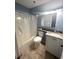 Clean bathroom with a shower/tub combo and granite vanity at 1100 Possum Trot Rd. # F-215, North Myrtle Beach, SC 29582