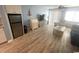 Living room with light-colored wood floors and a comfortable seating arrangement at 1100 Possum Trot Rd. # F-215, North Myrtle Beach, SC 29582