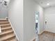 Bright entryway with staircase, view into living area, and neutral color scheme at 179 Hoffman Park Dr. # 69, Myrtle Beach, SC 29588