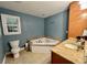 Relaxing bathroom featuring a corner tub, granite counters and custom wood vanity at 2347 Devine St., Georgetown, SC 29440