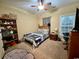 Cozy bedroom featuring natural light, ceiling fan, comfortable bed and a bookshelf at 2347 Devine St., Georgetown, SC 29440