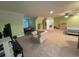 A spacious bedroom with carpeted floors, neutral colored walls, a ceiling fan, and a couch at 2347 Devine St., Georgetown, SC 29440