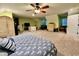 A spacious bedroom with a ceiling fan, neutral colored walls, carpeted floors, and an anchor patterned bedspread at 2347 Devine St., Georgetown, SC 29440
