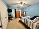 Comfortable bedroom with plush carpet, ceiling fan and natural light at 2347 Devine St., Georgetown, SC 29440