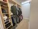 Organized walk-in closet with custom shelves and hanging racks for optimal clothing storage at 2347 Devine St., Georgetown, SC 29440