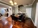 An inviting dining room with hardwood floors, a dining table, and a view into the living room at 2347 Devine St., Georgetown, SC 29440