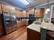 Updated kitchen featuring stainless steel appliances, granite countertops, and wooden cabinetry at 2347 Devine St., Georgetown, SC 29440